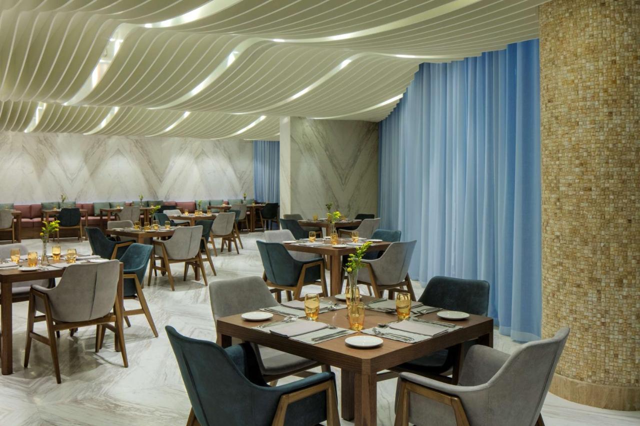 Radisson Blu Hotel Apartment Dubai Silicon Oasis Экстерьер фото